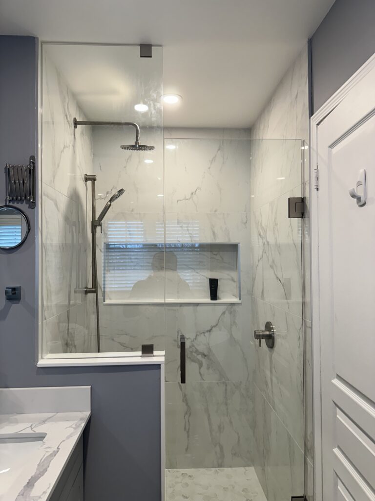 Contemporary bathroom renovation with coordinated tile and fixtures