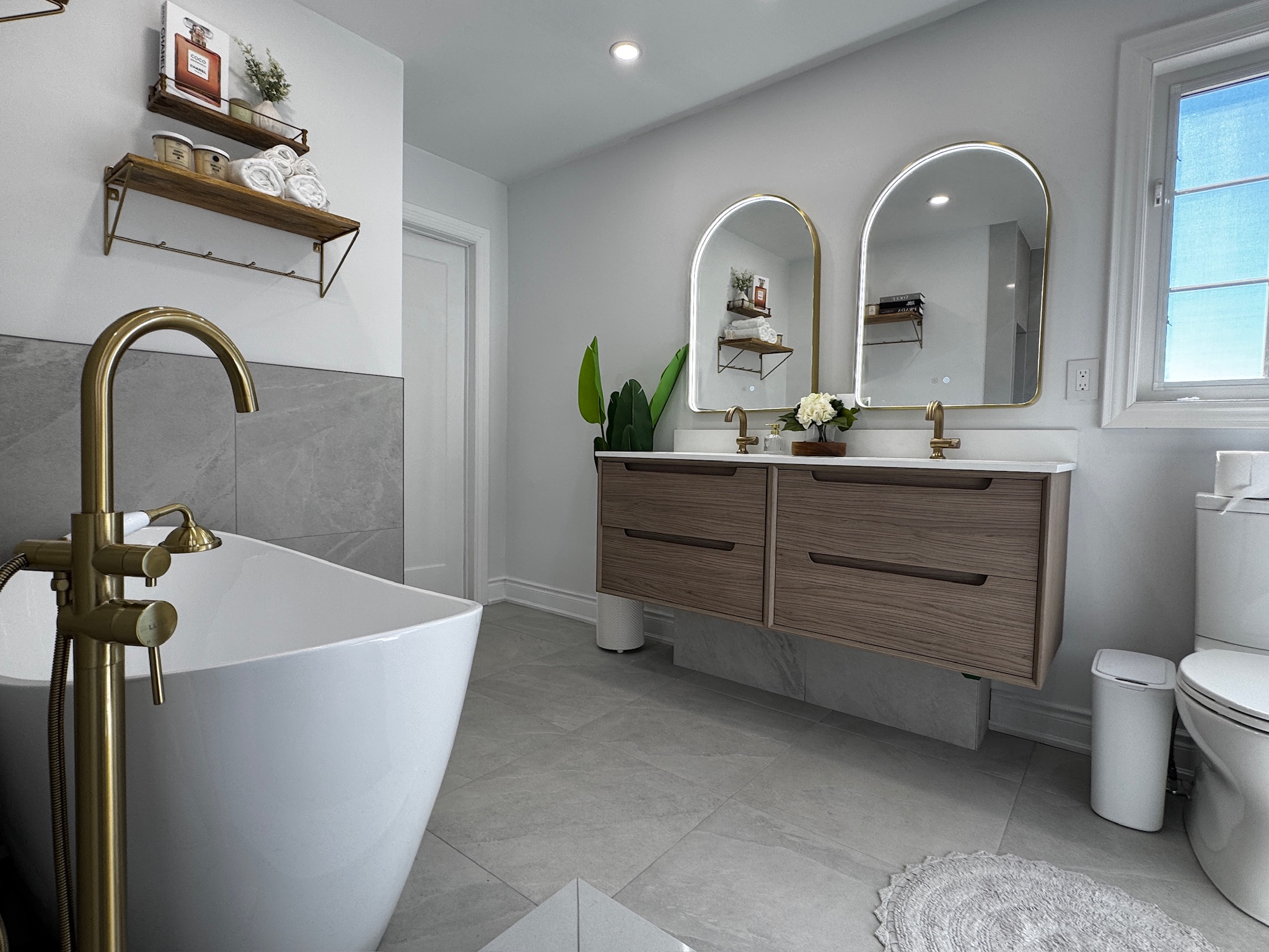 Completed bathroom with freestanding tub and double vanity