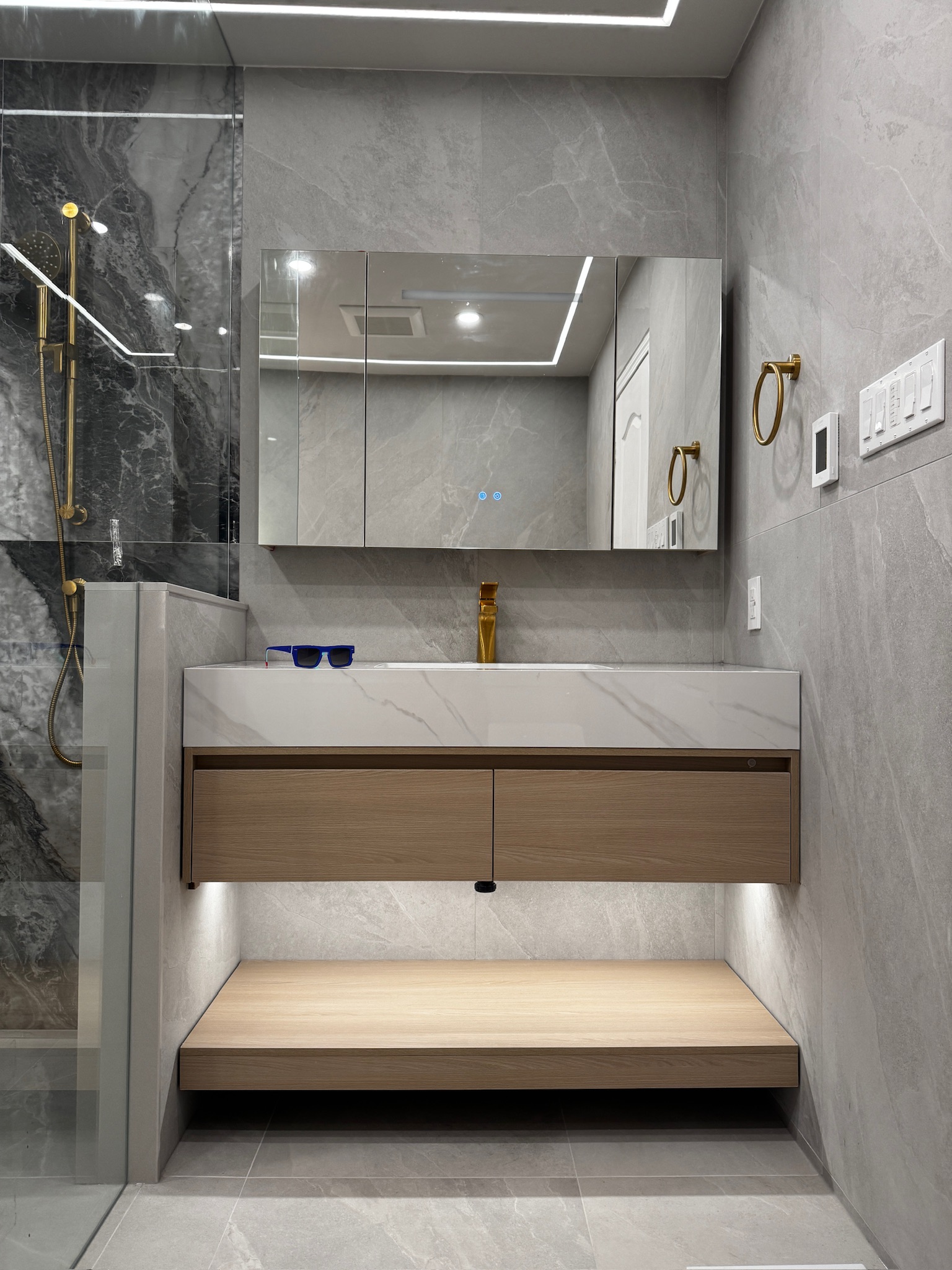 Modern marble-look shower and floating vanity