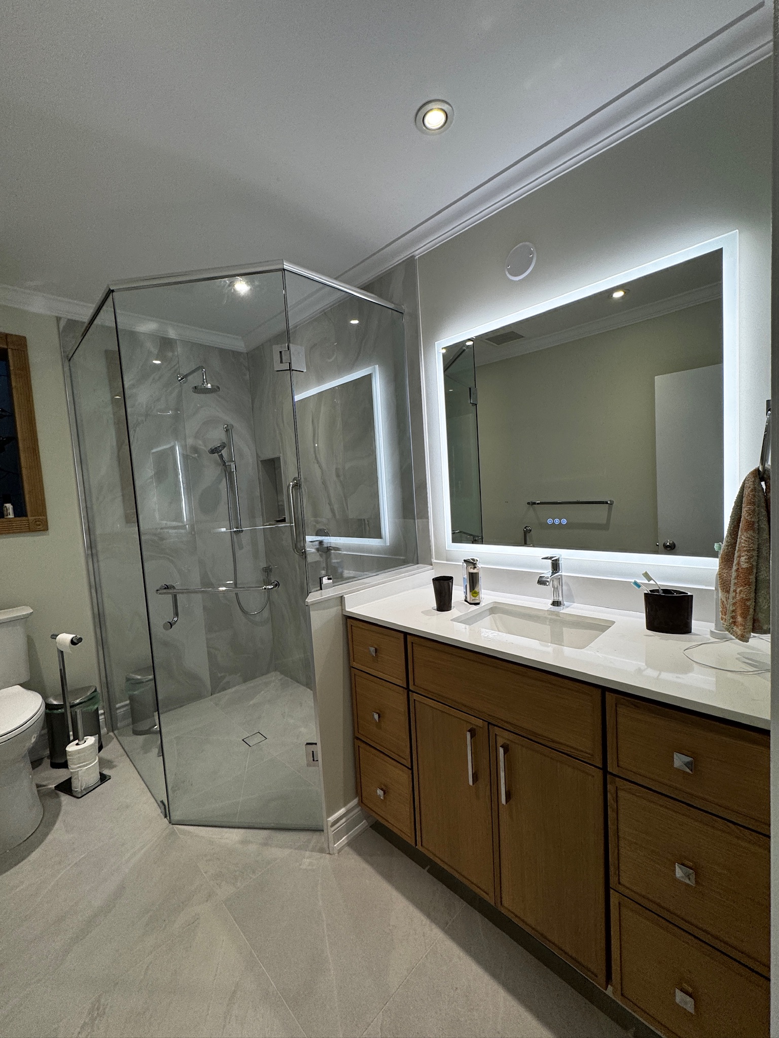 Glass Shower & Wood-Tone Vanity — completed Any Bathroom project